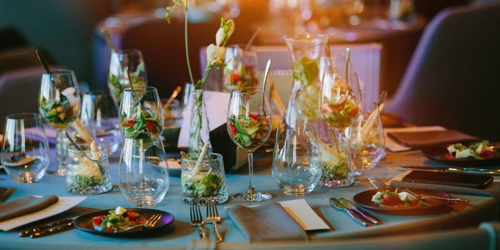 A beautifully set wedding table with elegant stationery and floral arrangements.