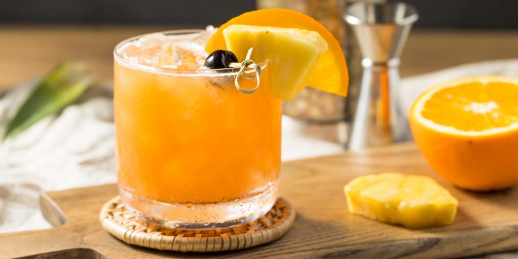 Refreshing Rum Runner cocktail with a tropical fruit garnish, perfect for summer.