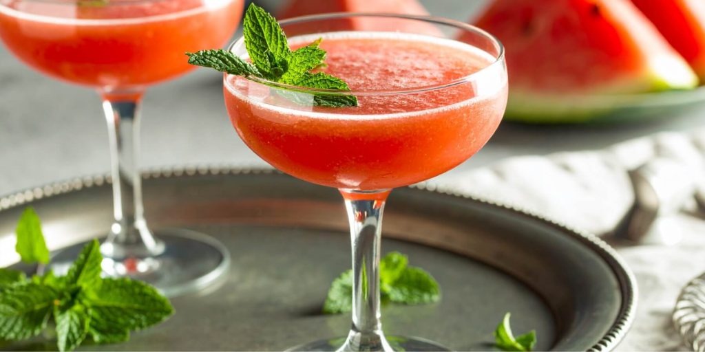 Close-up of a vibrant Watermelon Daiquiri with fresh mint garnish