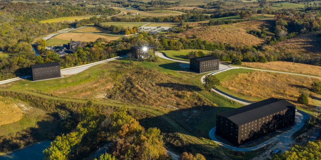 Four bourbon rickhouses set in a field on the Kentucky Bourbon Trail.