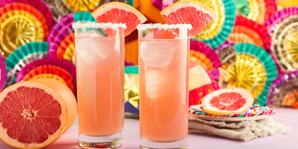 Refreshing Paloma cocktail garnished with a grapefruit slice, perfect for Cinco de Mayo.