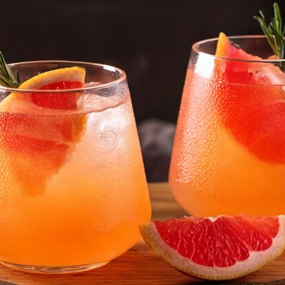 Two Paloma Mocktails with fresh grapefruit garnish